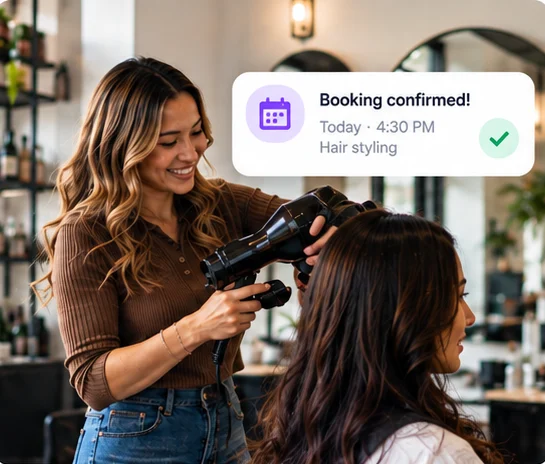 A salon stylist confirms a customer's booking, with a 'Booking confirmed' notification